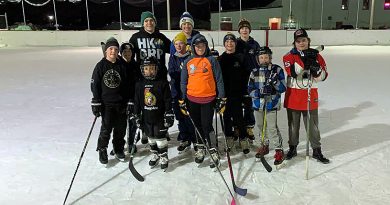 A photo of a group of players on the Carp outdoor rink.