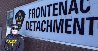A photo of Sgt. Jen Coles in front of the Frontenac detachment.
