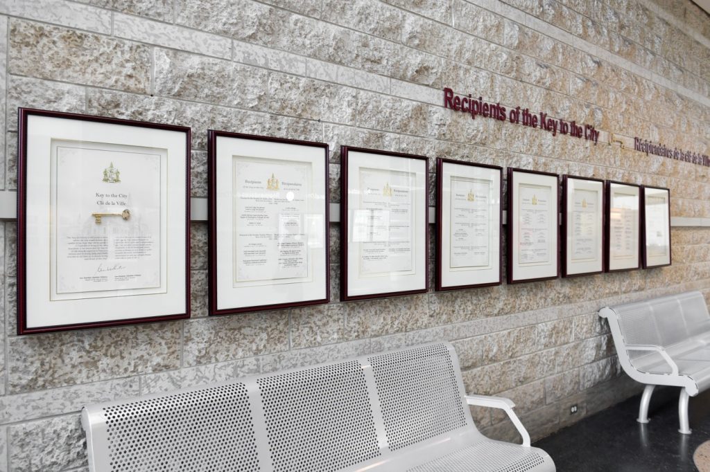 A pgoto of the certificates of those awarded the Key to the City.