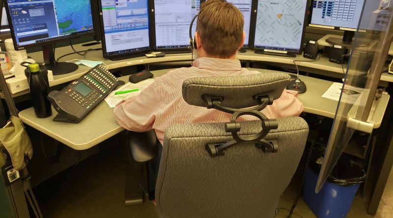 A photo of dispatcher Chris Allan at work.