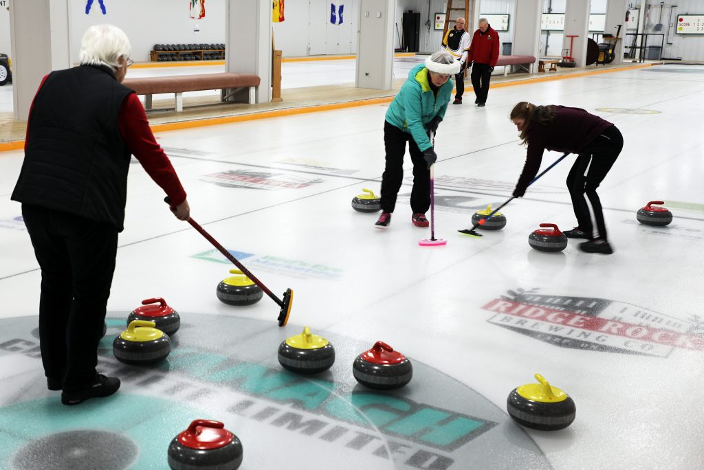 A photo of curling action from Sunday's tournament.