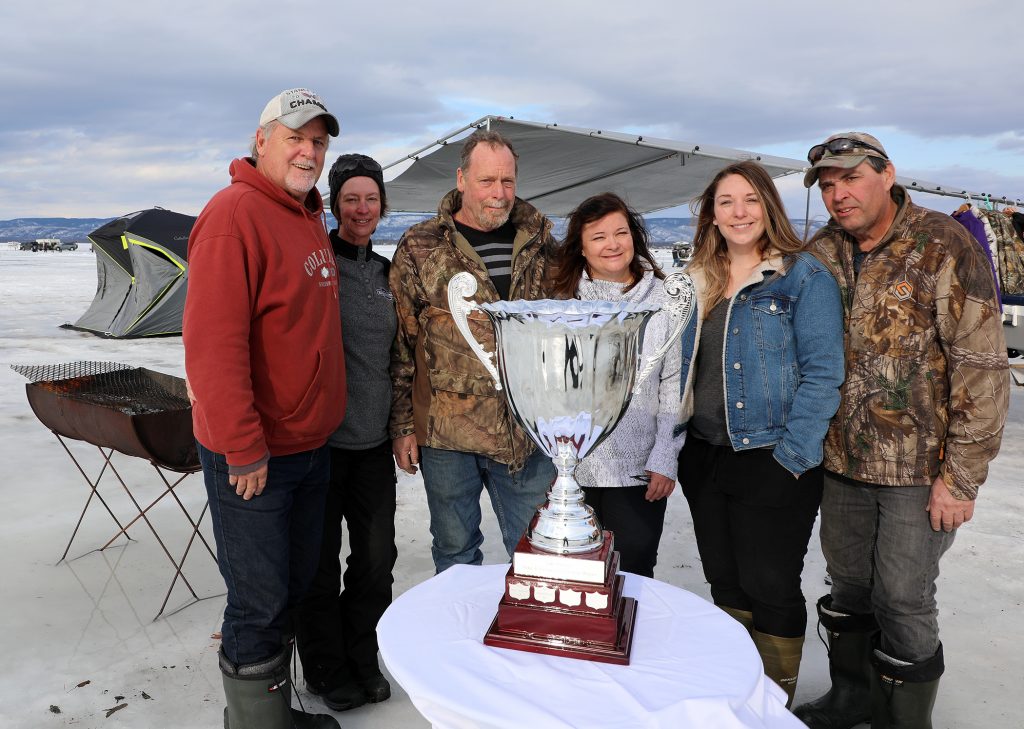 From left, tournament organizers Mike Fines, Julie Delahunt, Peter Strong, Jodi Spangaro, Stacey Strong and Steve Small pose for a photo with the championship trophy at the 15th annual Mike and Peter’s Fishing Derby. Photo by Jake Davies
