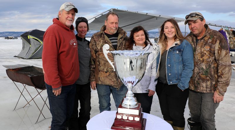 From left, tournament organizers Mike Fines, Julie Delahunt, Peter Strong, Jodi Spangaro, Stacey Strong and Steve Small pose for a photo with the championship trophy at the 15th annual Mike and Peter’s Fishing Derby. Photo by Jake Davies