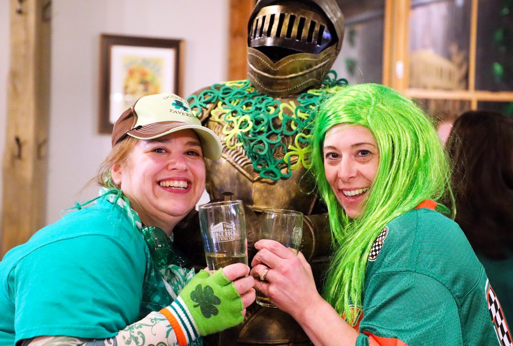 A photo of two women celebrating St. Patrick's Day at the Ridge Rock.