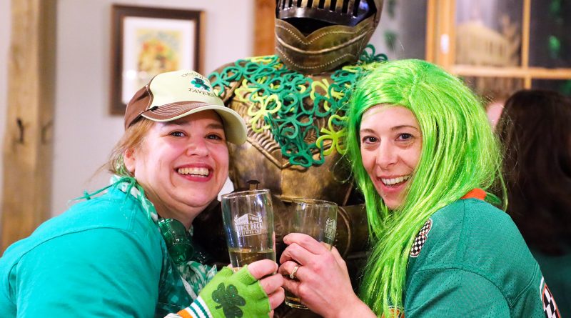 A photo of two women celebrating St. Patrick's Day at the Ridge Rock.