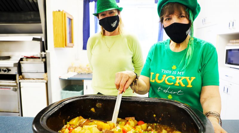 A photo of volunteers and Irish stew.