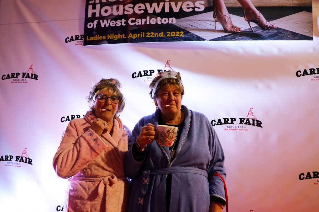 A photo of two ladies on the catwalk.