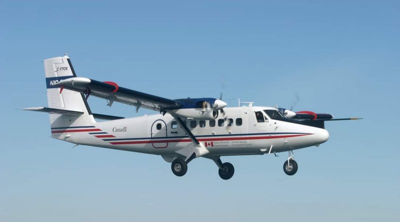 A photo of a Twin Otter in flight.