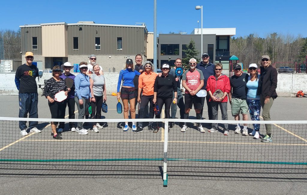 A group photo of the pickleball club.