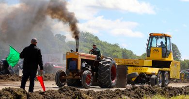 A photo of a tractor pulling.