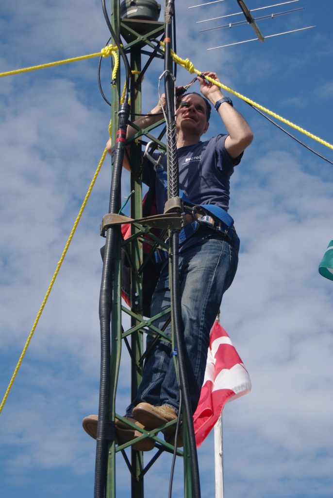 Bert Zauhar installs an antenna.