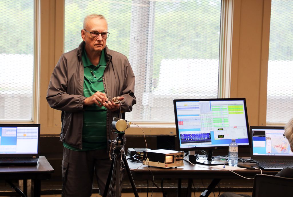 A member works with a radar gun.