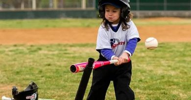 A young girl takes a swing.