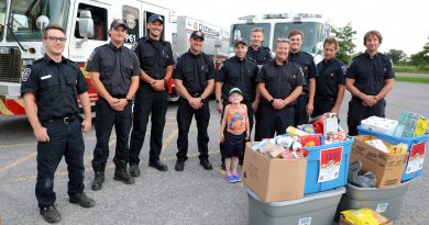 A photo of firefighters and a food donation.