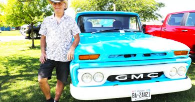 Jorgen Jensen poses by his GMC truck.