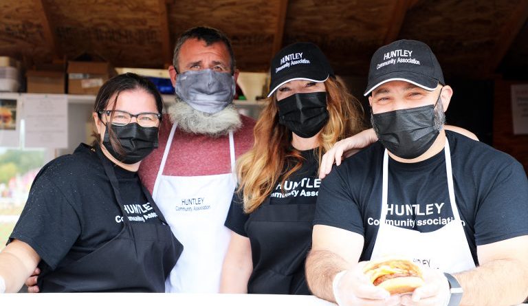 A photo of volunteers at the Huntley Burger hut.
