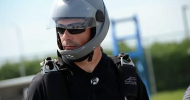 A photo of Jeff Dean in skydiving gear.
