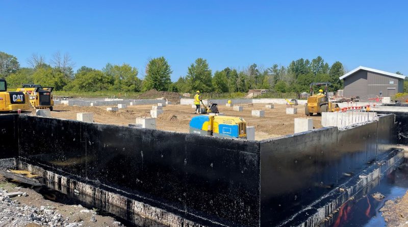 A photo of the foundation of the new facility.