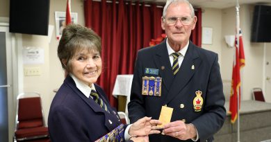 A photo of Legion members Arleen and George receiving their pins.