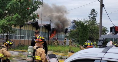 Firefighters battle a fire at a vacant school.