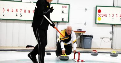 AA photo of a man curling.