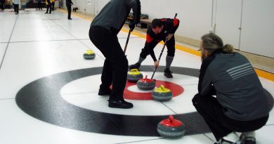 A photo of people curling.