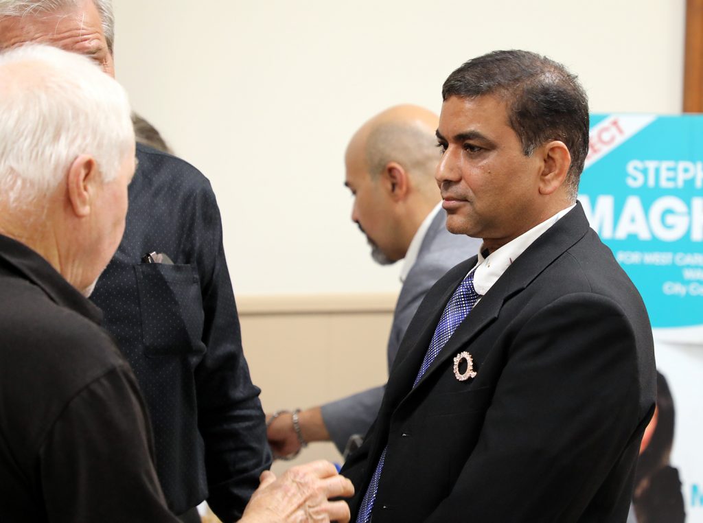 Nagmani Sharma speaks with a voter.