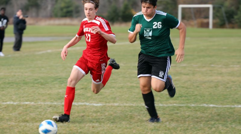 A photo of two players battling for the ball.