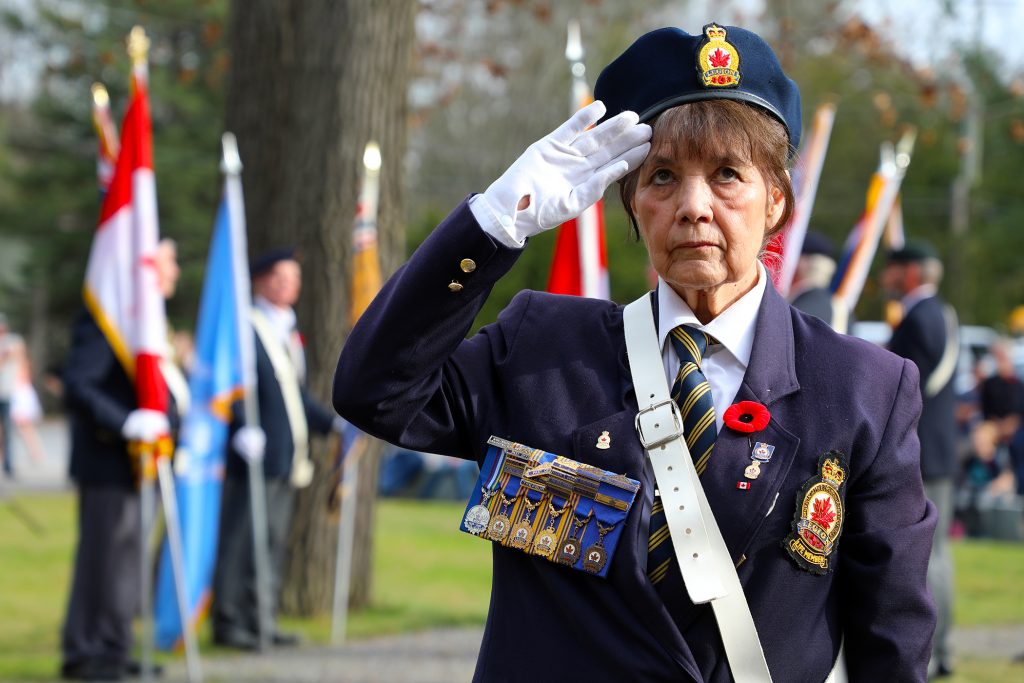 A photo of a woman saluting.