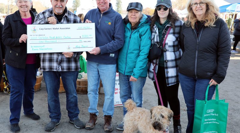 From left, WCFAC’s Sharon Roper, Coun. Eli El-Chantiry, Carp Farmers’ Market President Randy Maguire, WCFAC’s Mary Braun, Ennio’s daughter Maritza and wife Maggie pose for a photo during a cheque presentation to the WCFAC. Photo by Jake Davies