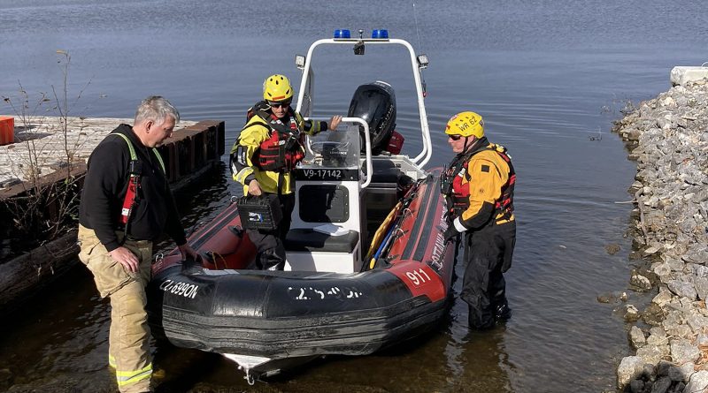 A photo of the water rescue crew and their boat.