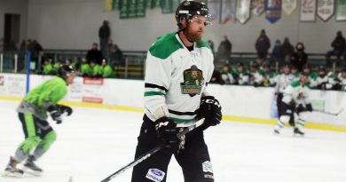 A photo of Adrian Moyes playing hockey against the Islanders.