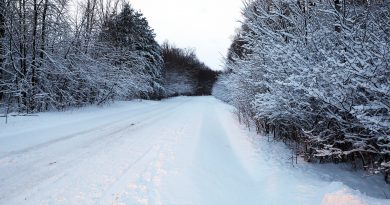 A photo of a snowy road.