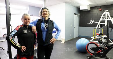 A photo of two gym instructors inside a gym.
