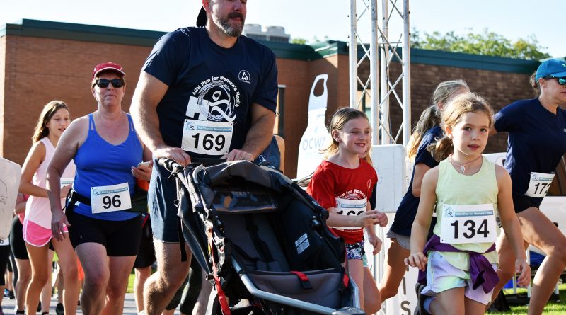 A photo of a family running.