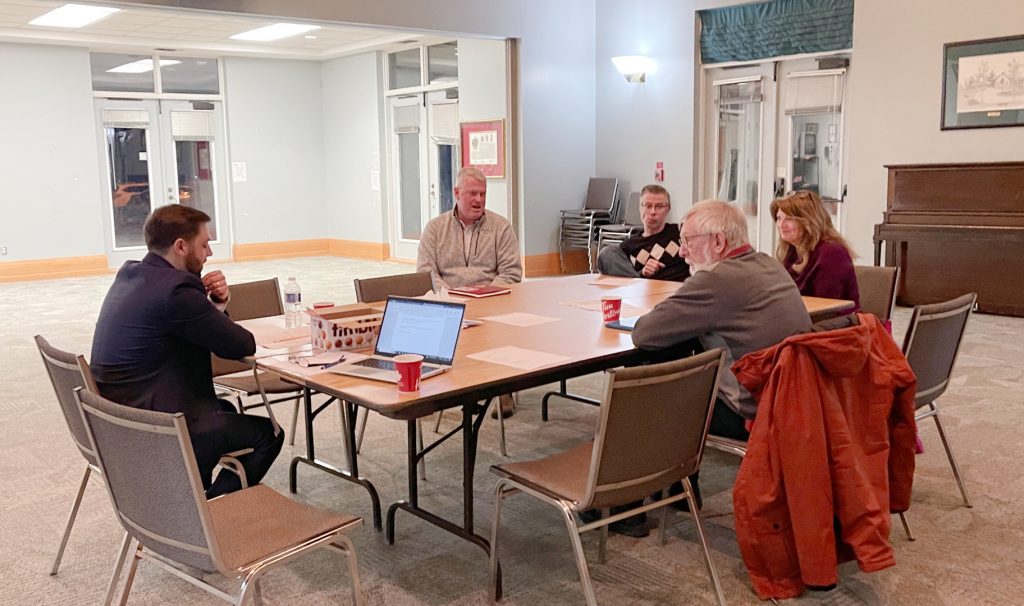 A photo of a group of people at a table.