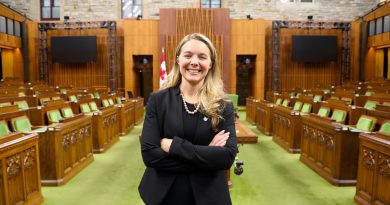 Jenna Sudds standing in the House of Commons.