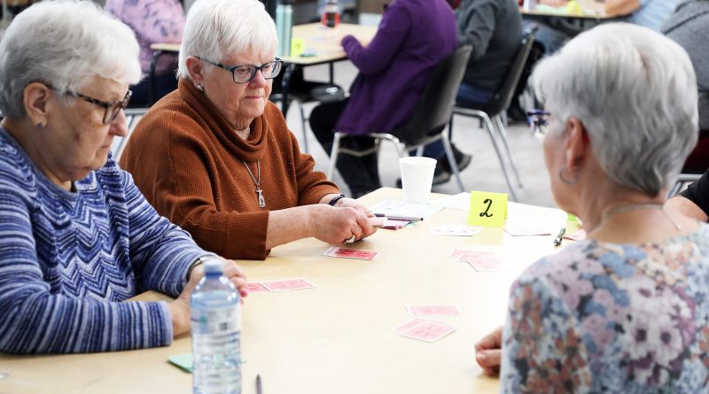 A photo of people playing euchre.