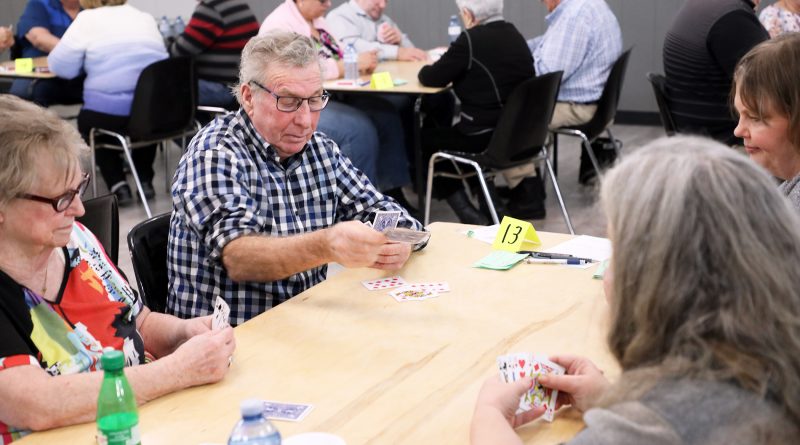 A photo of people playing euchre.