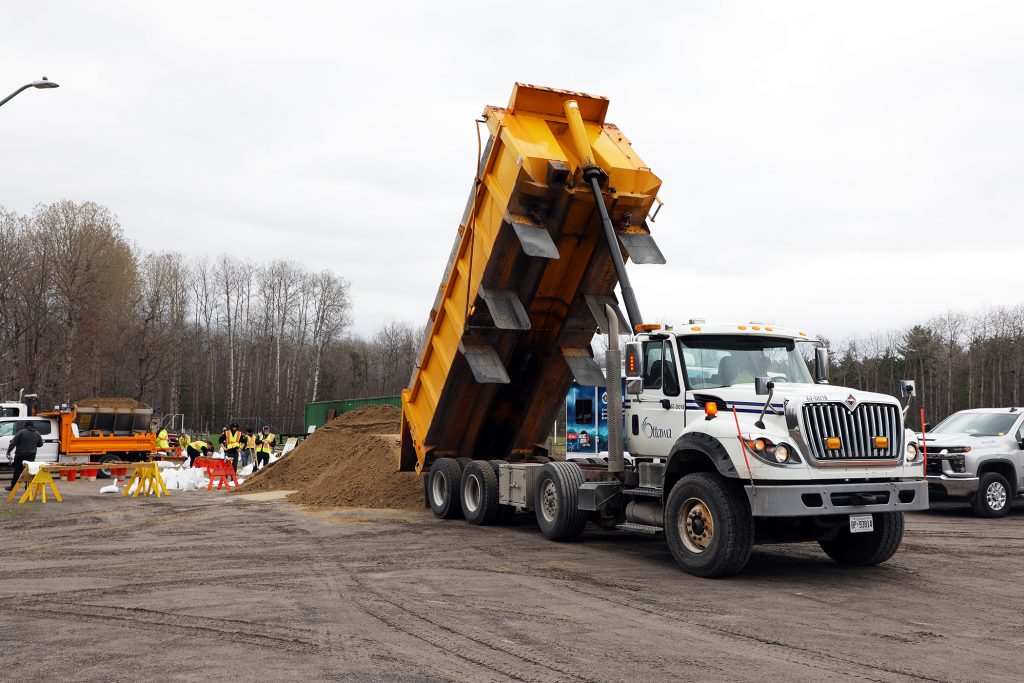 A dump truck dumps its load.