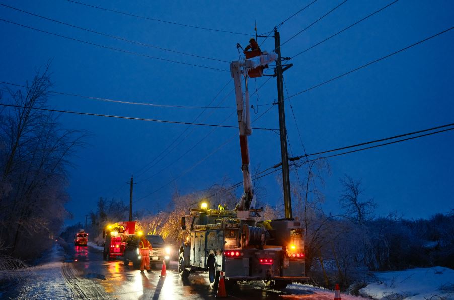 A photo of hydro crews working at night.
