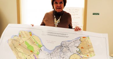 A woman holds a map.