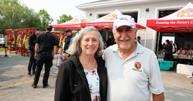 Two people pose for a photo.