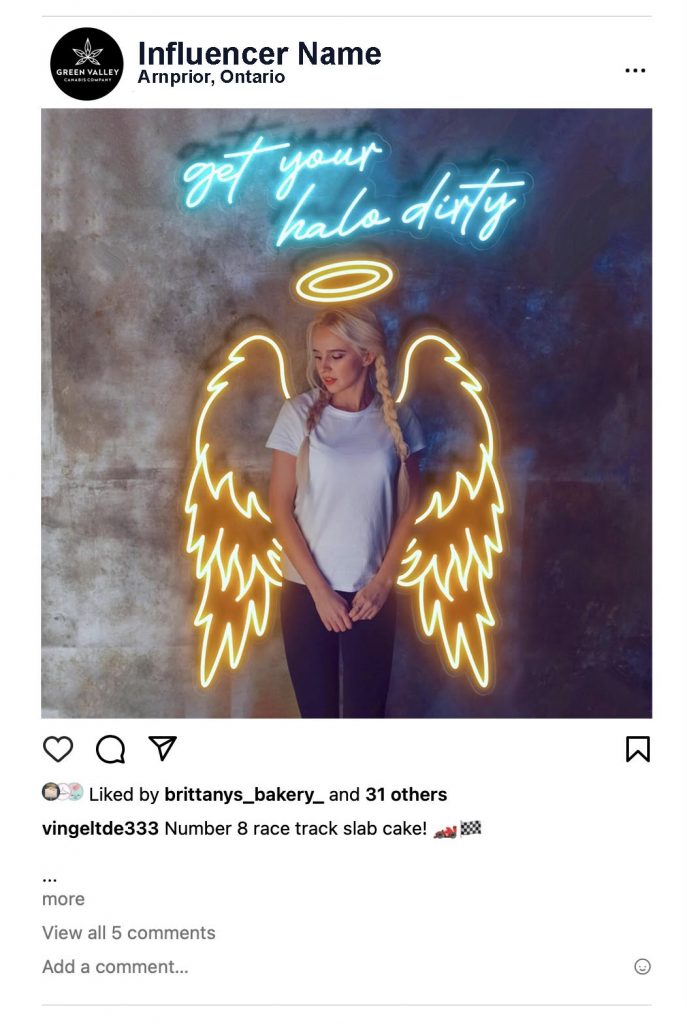 A photo of someone posing in front of angel wings.