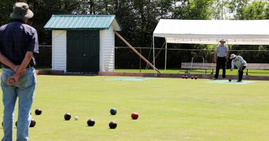 A photo of a lawn bowling game.