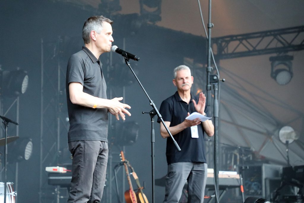 A photo of a man speaking.