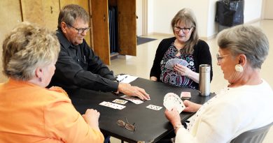 A photo of people playing cards.