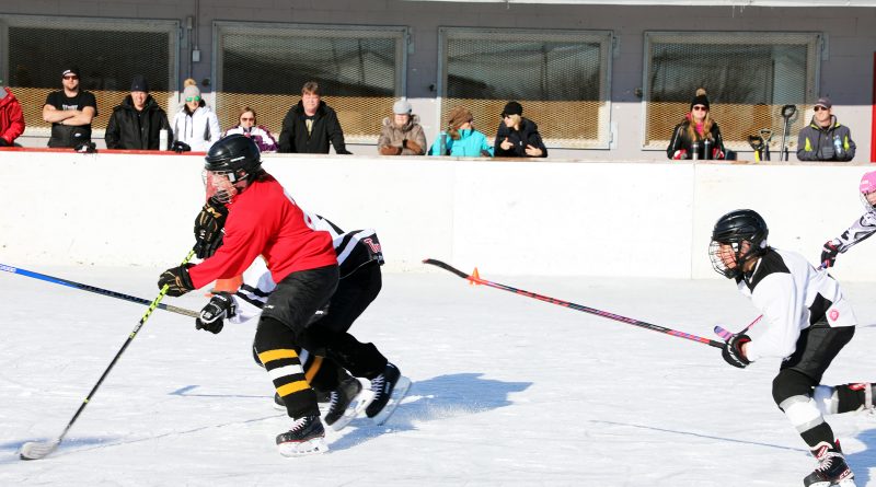 A photo of people playing hockey outside in Carp.