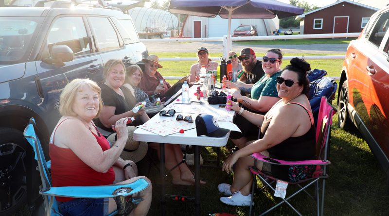 A group sits at a table playing bingo.