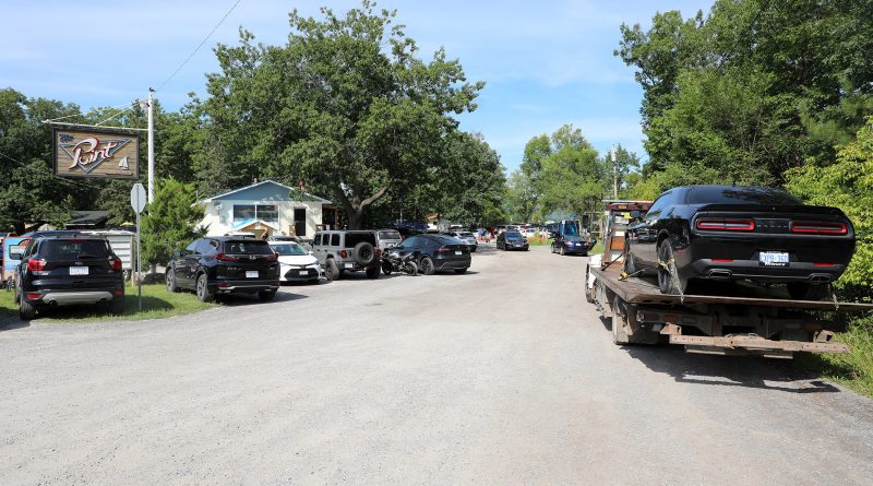 A photo of a car on a tow truck.